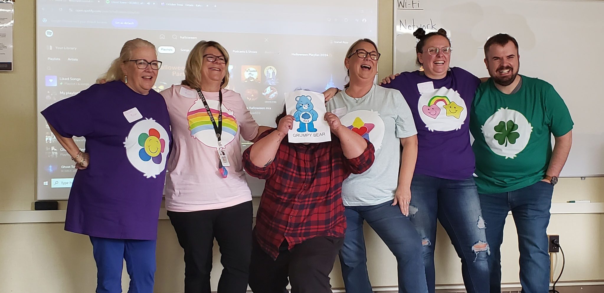 Special Ed staff wearing Care Bear themed shirts