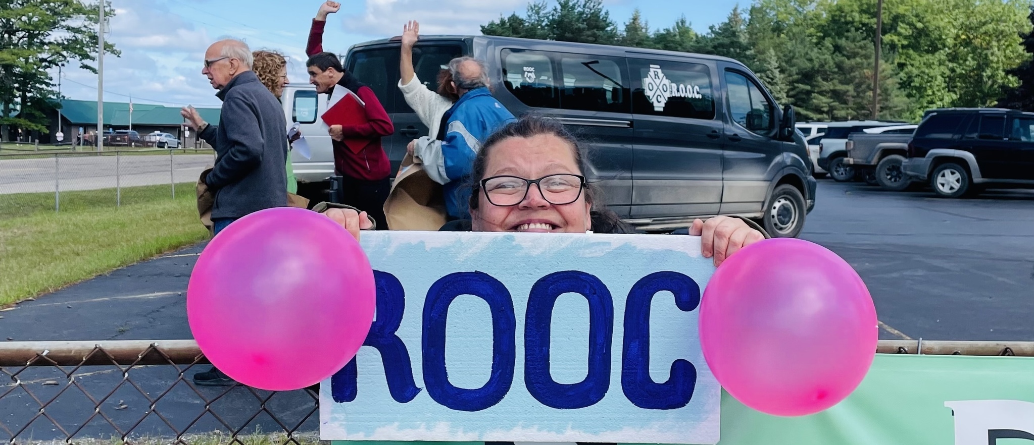 Person holding ROOC sign